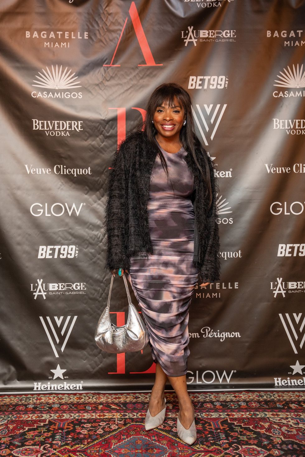 Anne-Lovely \u00c9tienne au tapis rouge de L'Auberge Saint-Gabriel pour les festivit\u00e9s du Grand Prix de la F1.