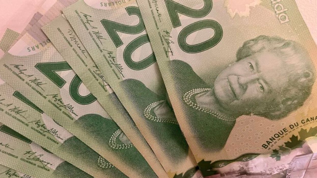 Des billets de 20 $ canadien sont placés en éventail.