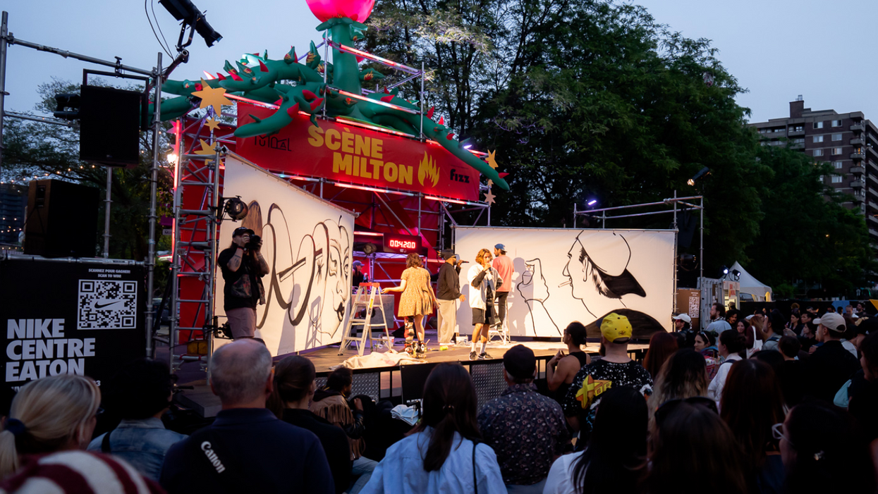 La scène Milton du Festival Mural lors d'un concours de peinture devant une foule.