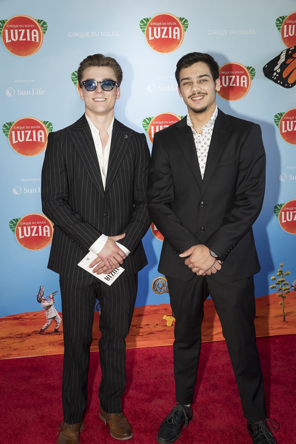 Les athl\u00e8tes d'\u00c9quipe Canada F\u00e9lix Dolci et Jayson Rampersad sur le tapis rouge de Luzia du Cirque du Soleil.