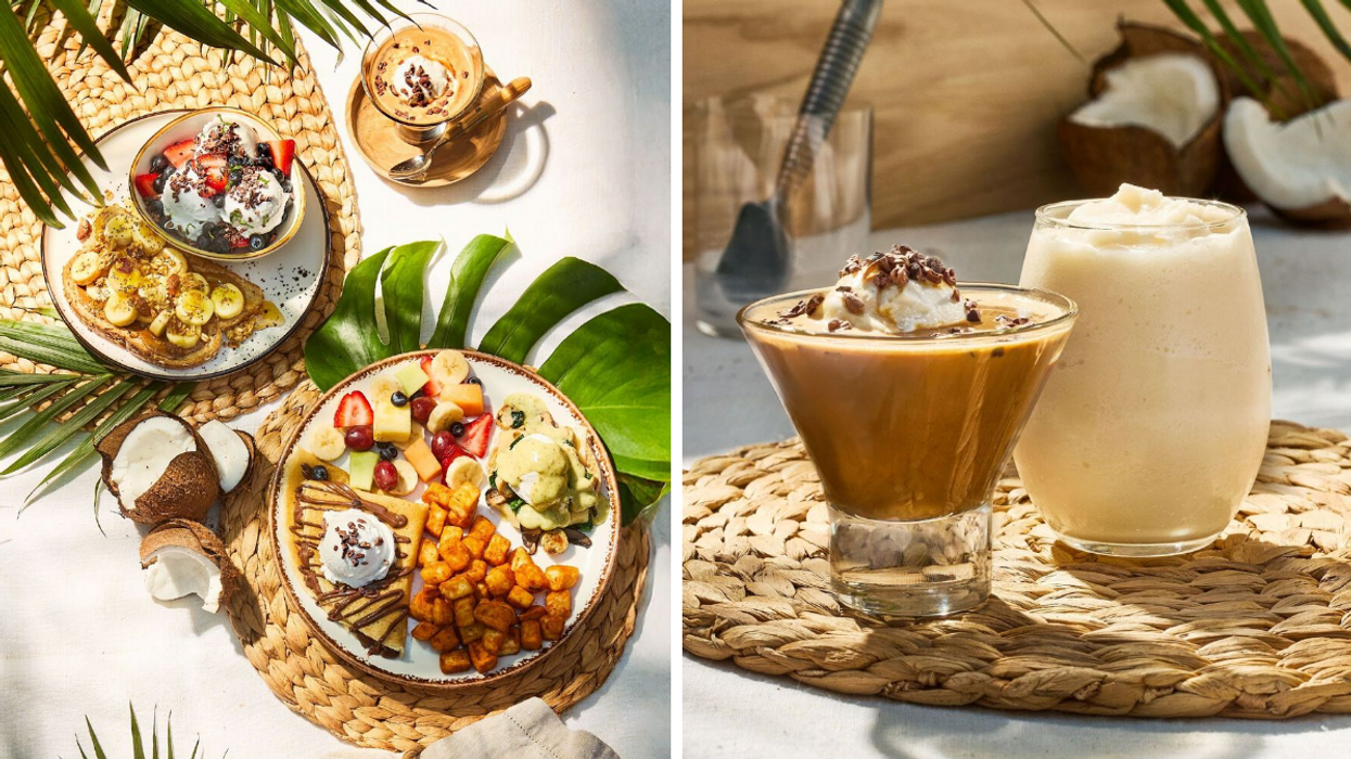 Overhead view of tropical brunch plates featuring waffles with bananas, crepes with berries and whipped cream, fresh fruit, and coconut decor on a sunny table setting. Right: Close-up of an iced latte topped with whipped cream and a creamy coconut smoothie served on a woven placemat with coconut halves in the background.
